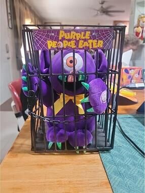 Purple People Eater Plush Toy in Cage